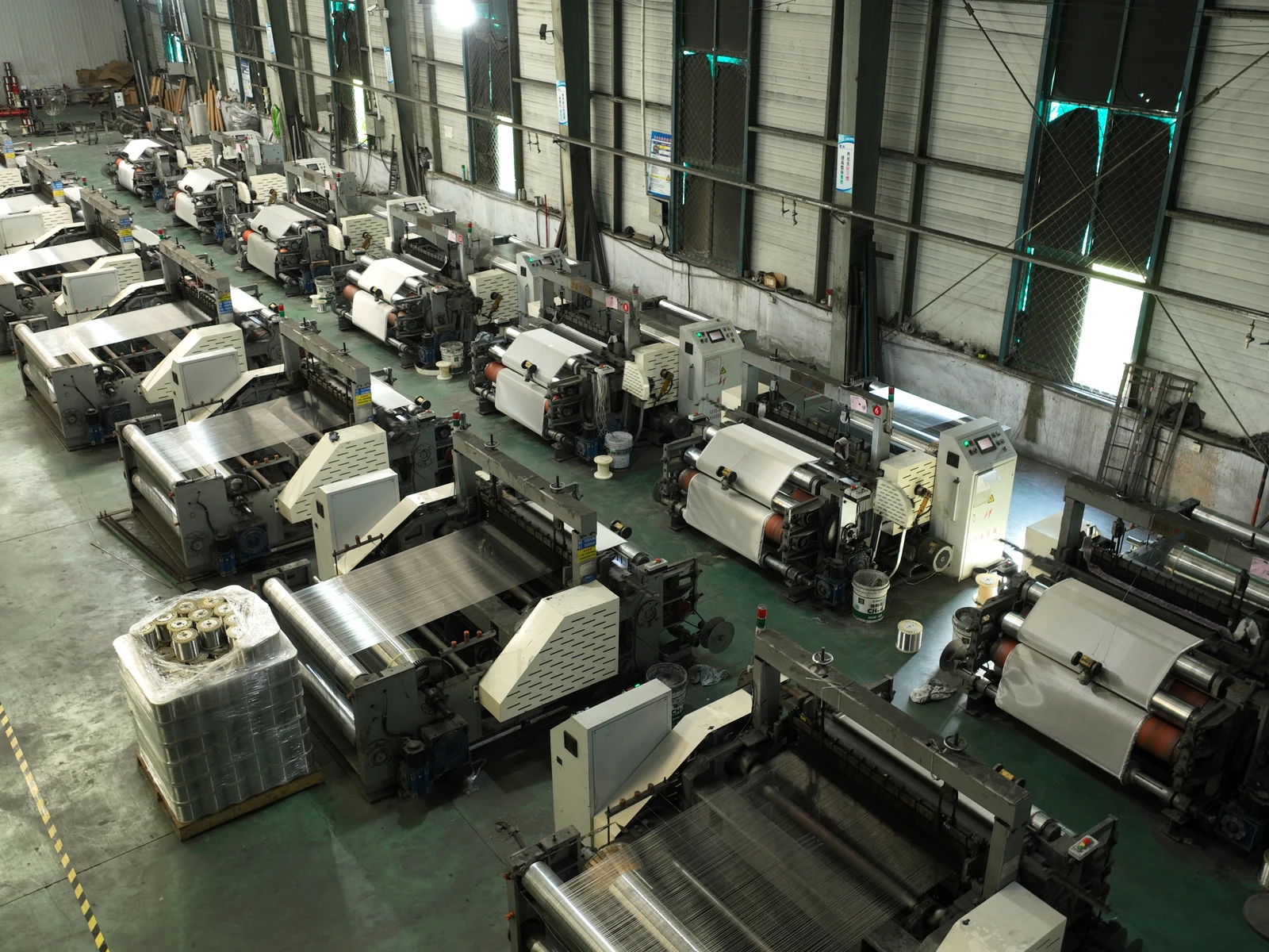 Rows of weaving equipment inside the AMBER workshop