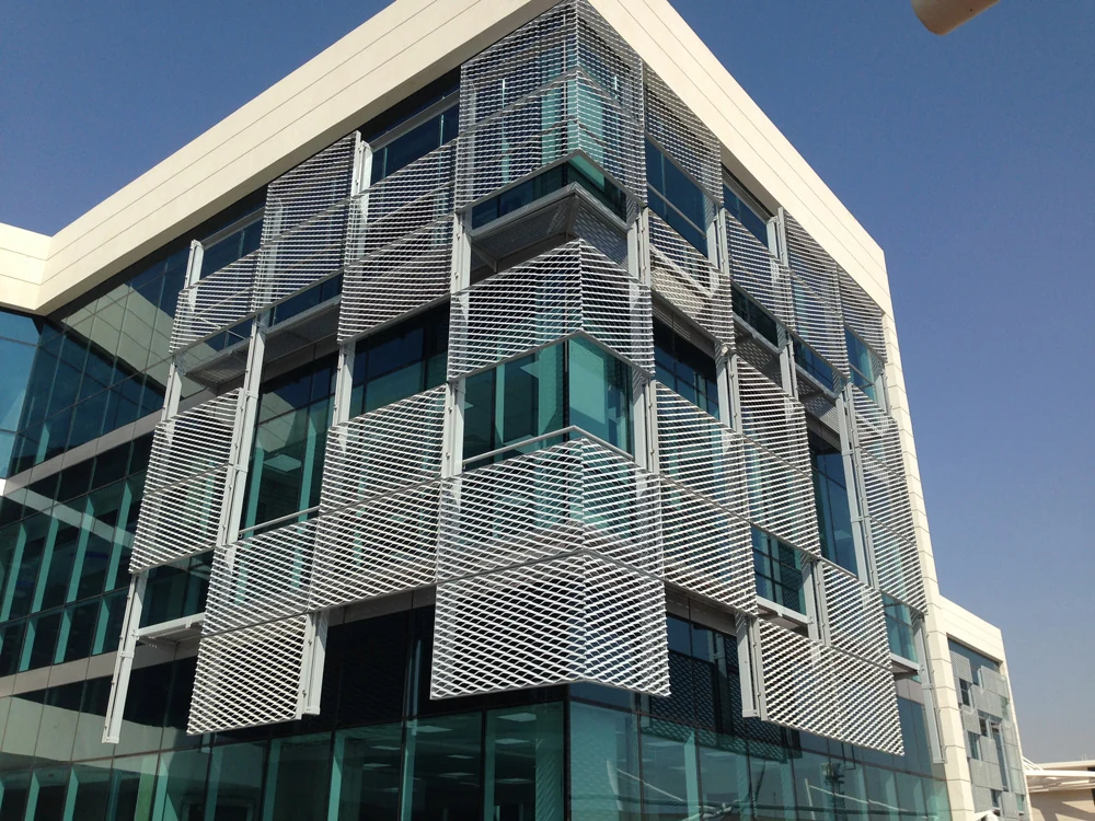 Expanded metal screens enclosing projecting balconies on a building