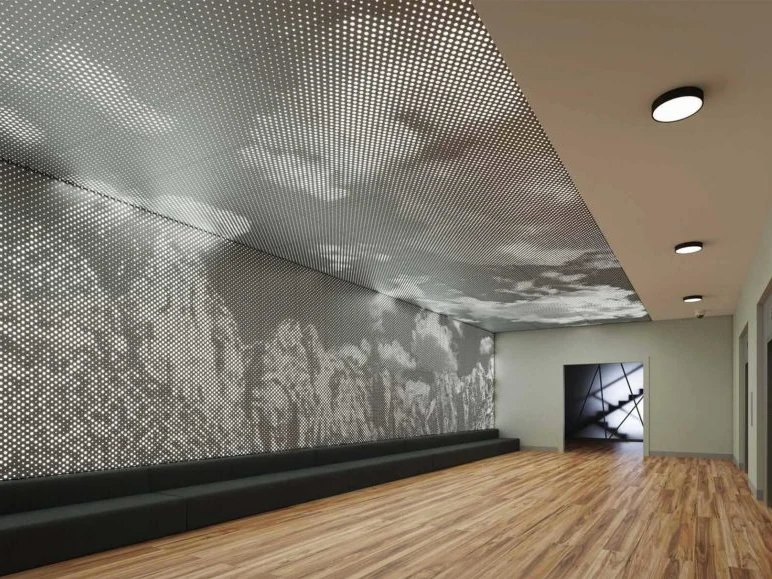 Patterned perforated metal walls and ceiling above a timber floor