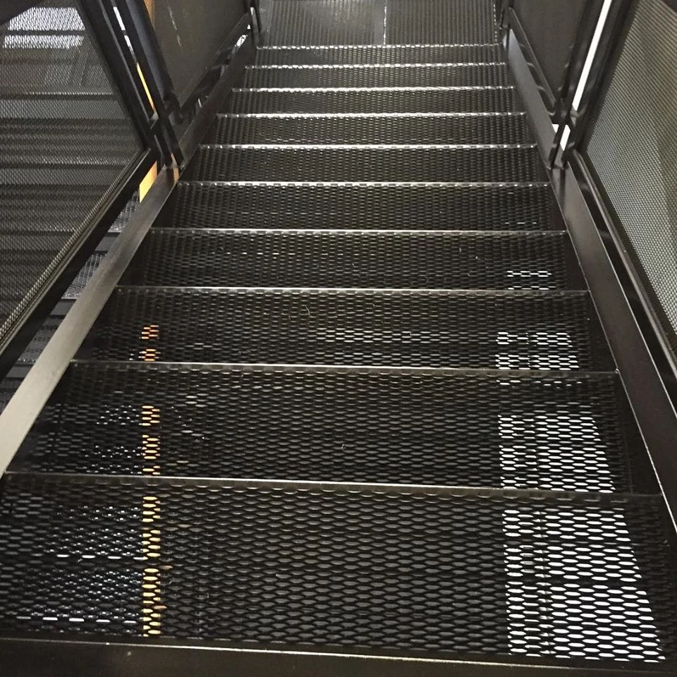 Expanded metal grating forming stair treads within a steel frame