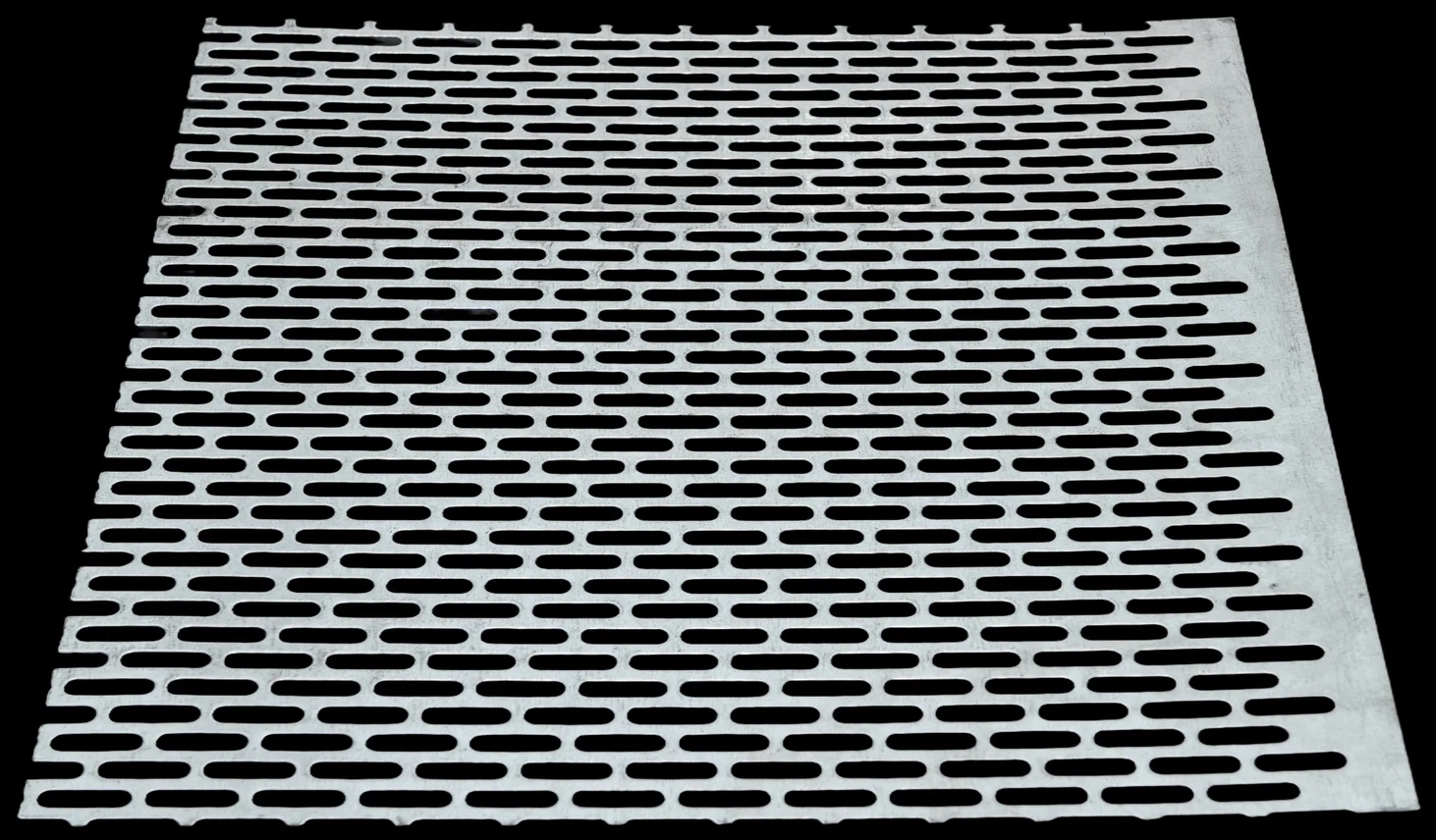 Perforated metal sheet sample with elongated slots
